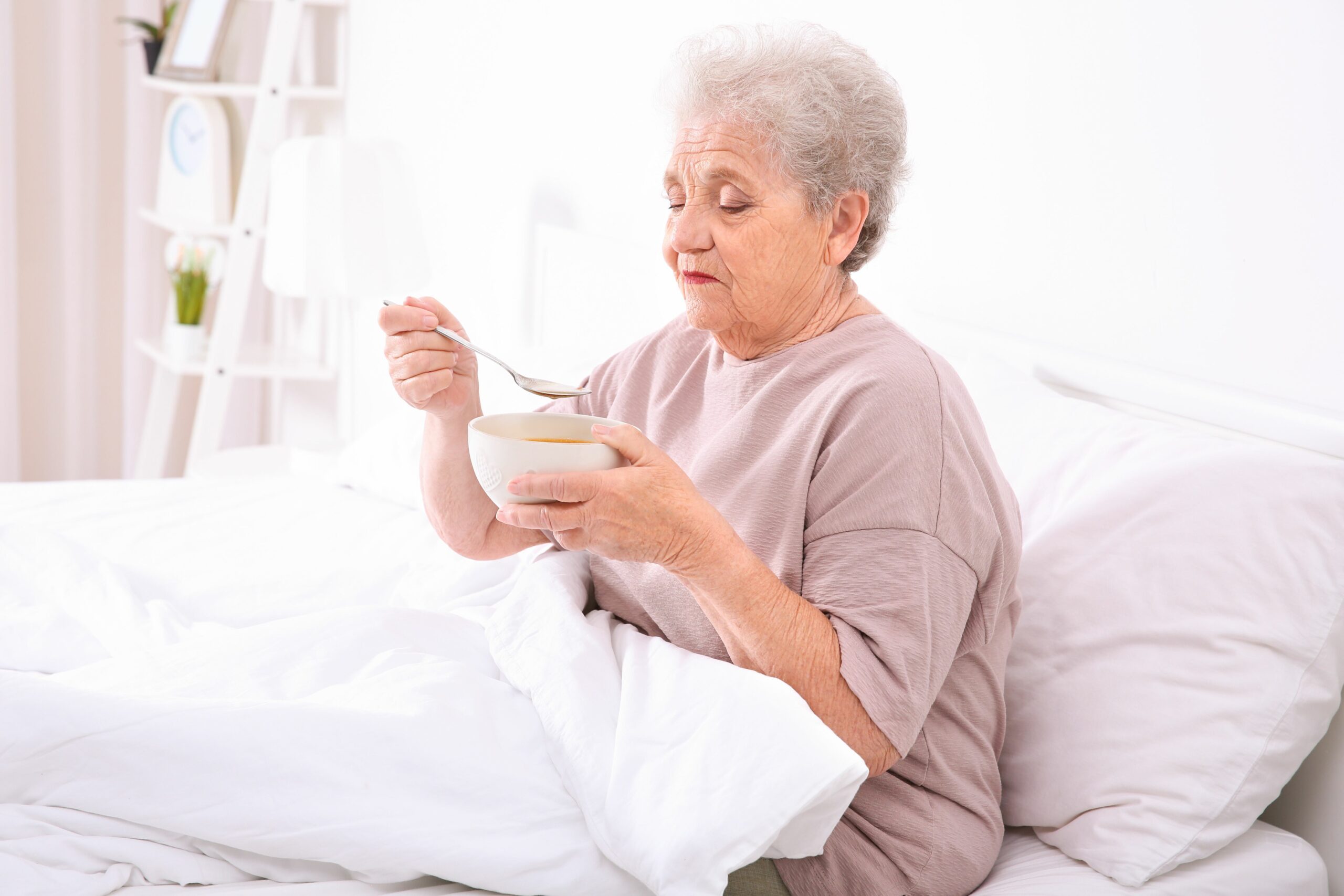 Rosemont Pharmaceuticals - The Link Between Alzheimer’s Disease and Dysphagia - Elderly lady eating soup